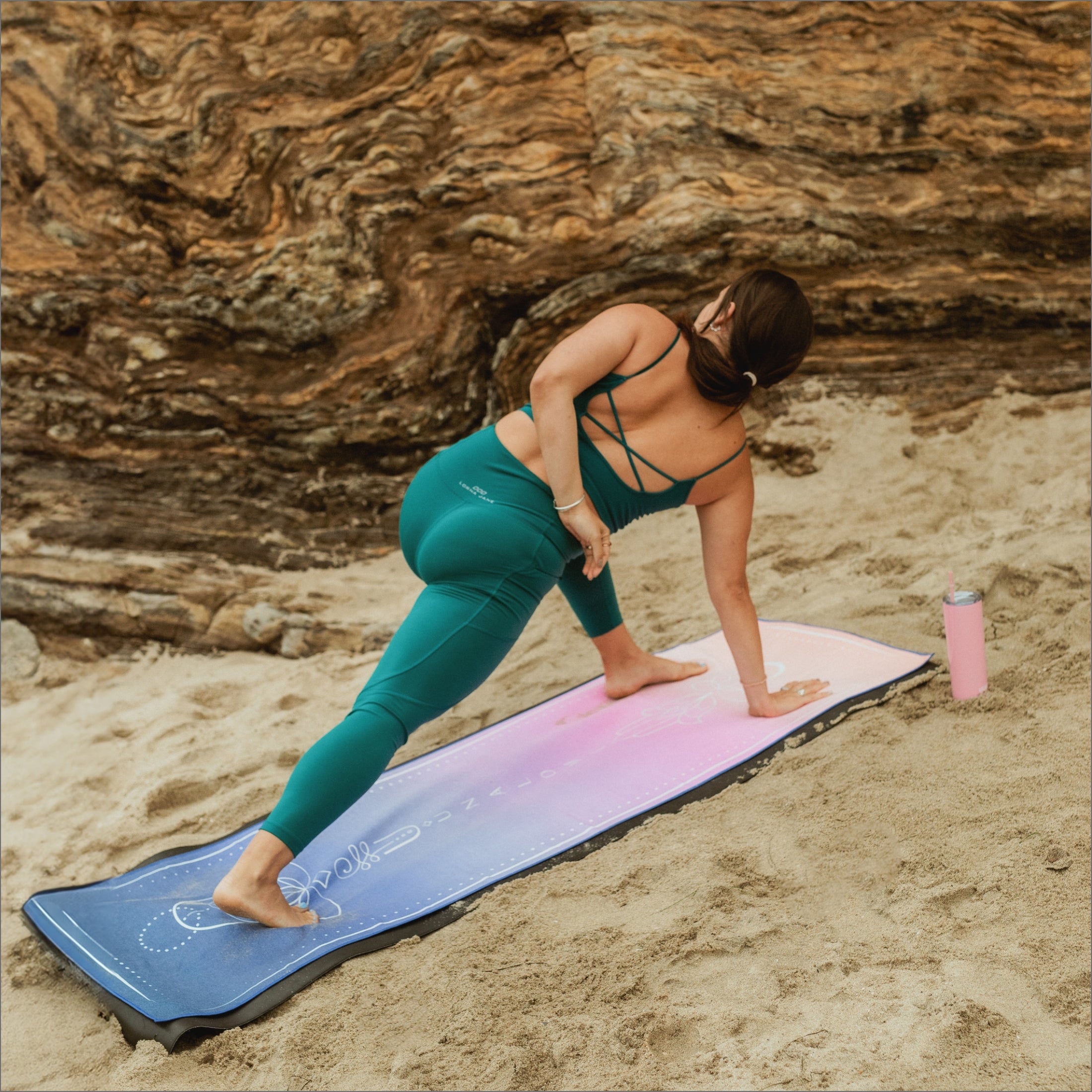 yogi doing yoga at beach on Unalome Yoga non slip and eco friendly Sunset towel.
