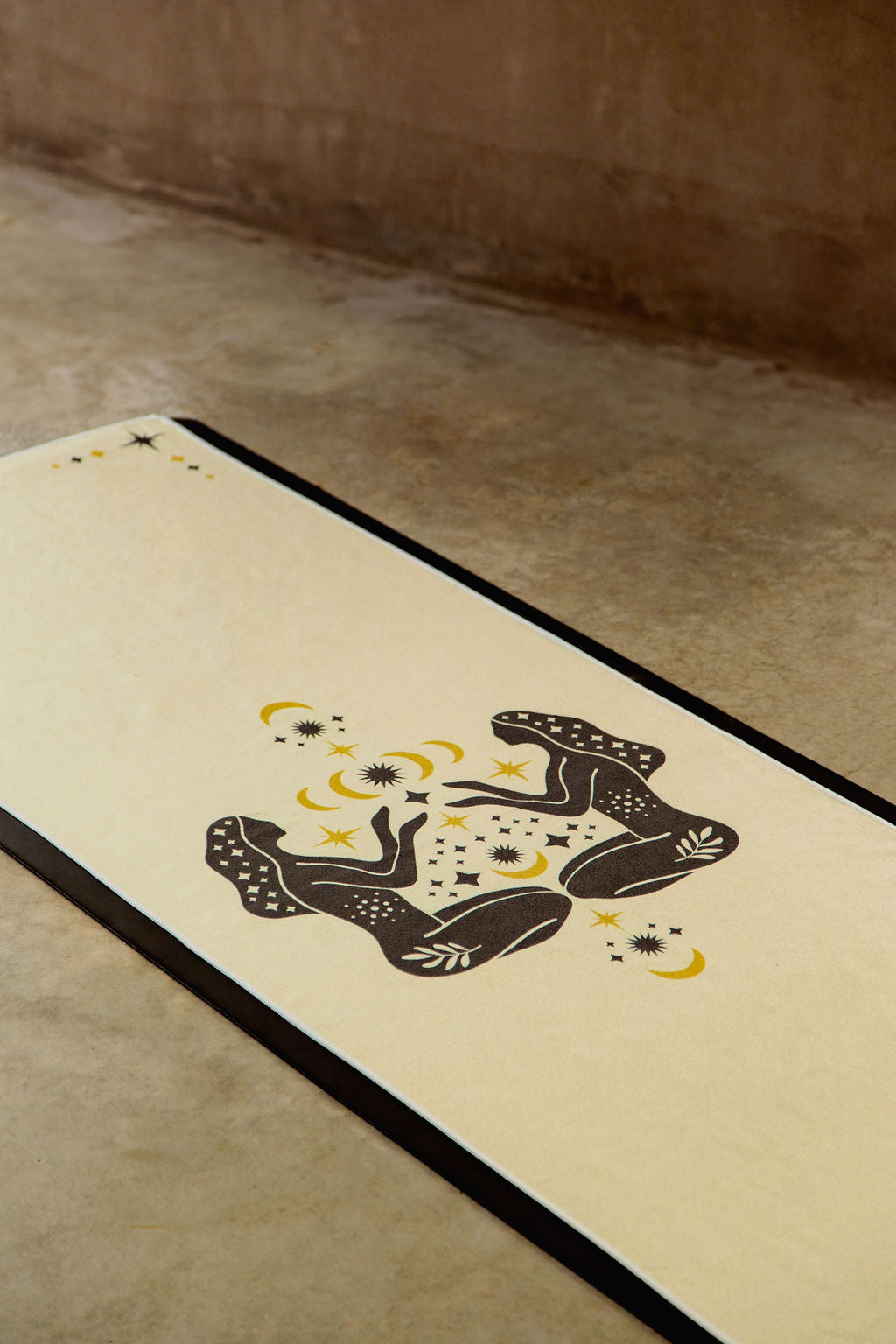 buttery yellow yoga towel rolled with Unalome logo – eco-friendly, non-slip towel for heated yoga, hot pilates and vinyasa yoga.